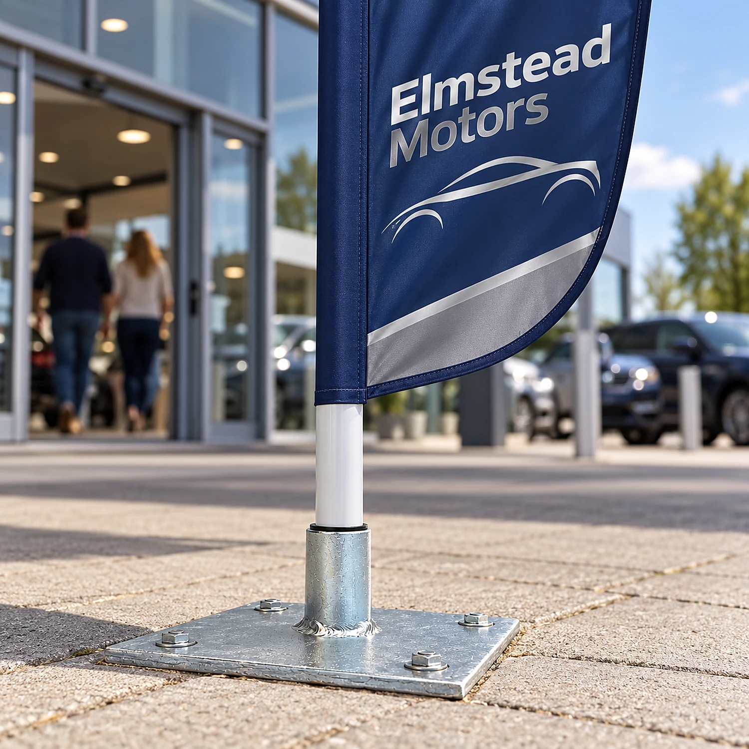 Floor mount bolted into paving holding a feather flag