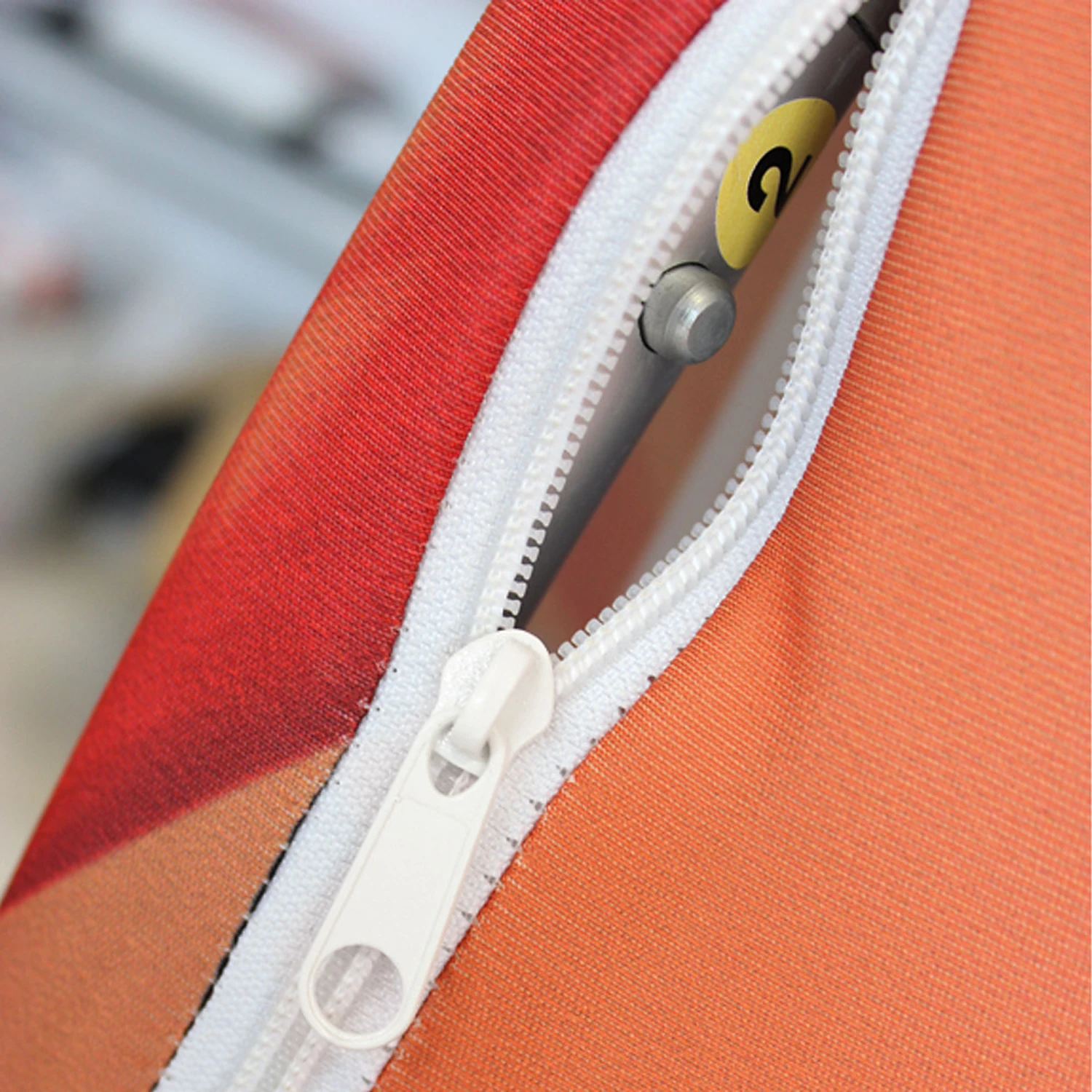 Zipped fabric graphic sleeve over the curved frame