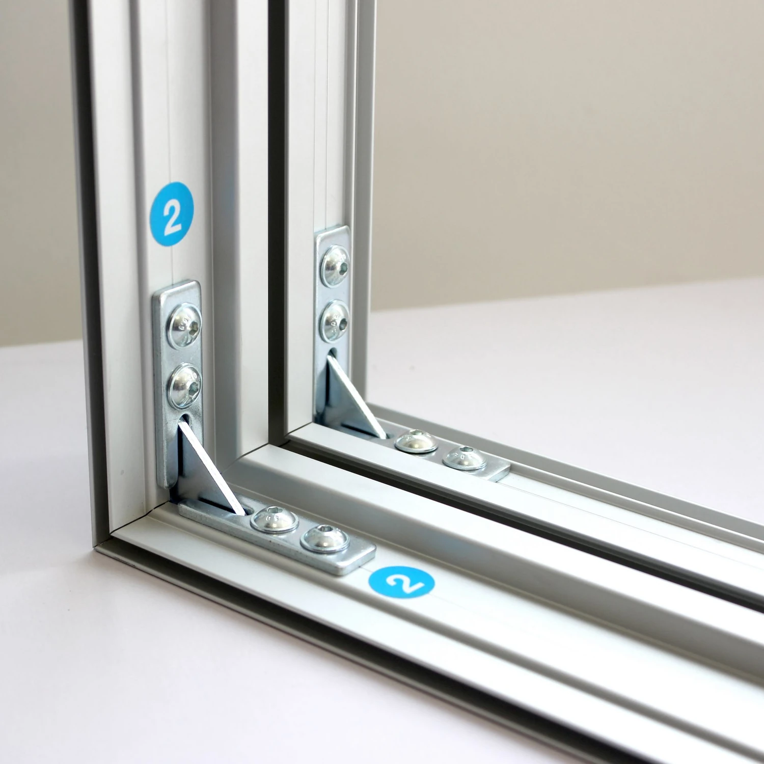 Lightbox frame corner bracket with assembly labels