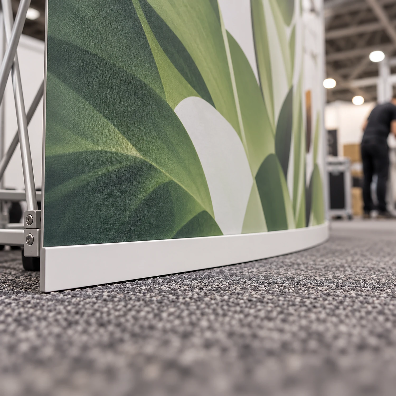 Front curved kicker along the bottom of a pop up graphic panel