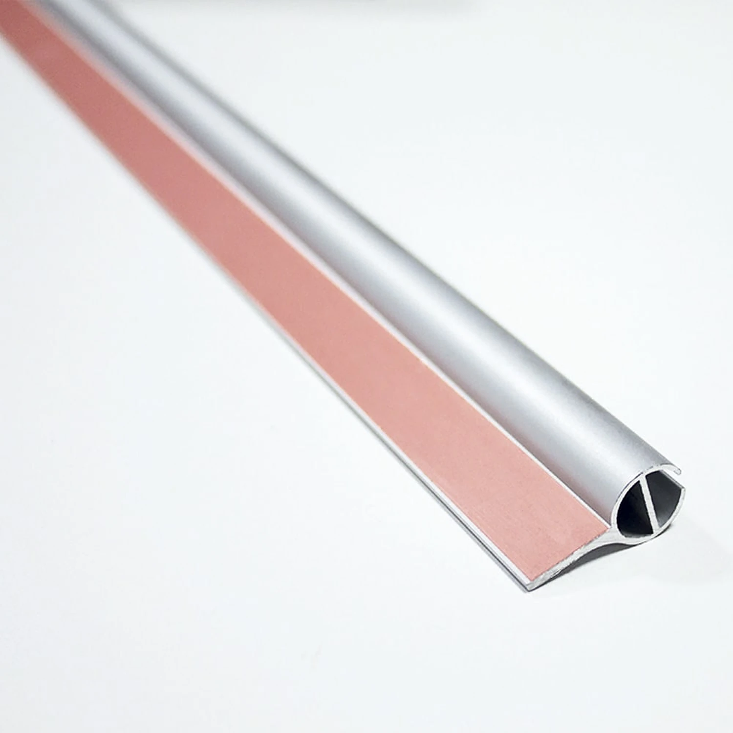Roller banner top rail with adhesive strip for the graphic