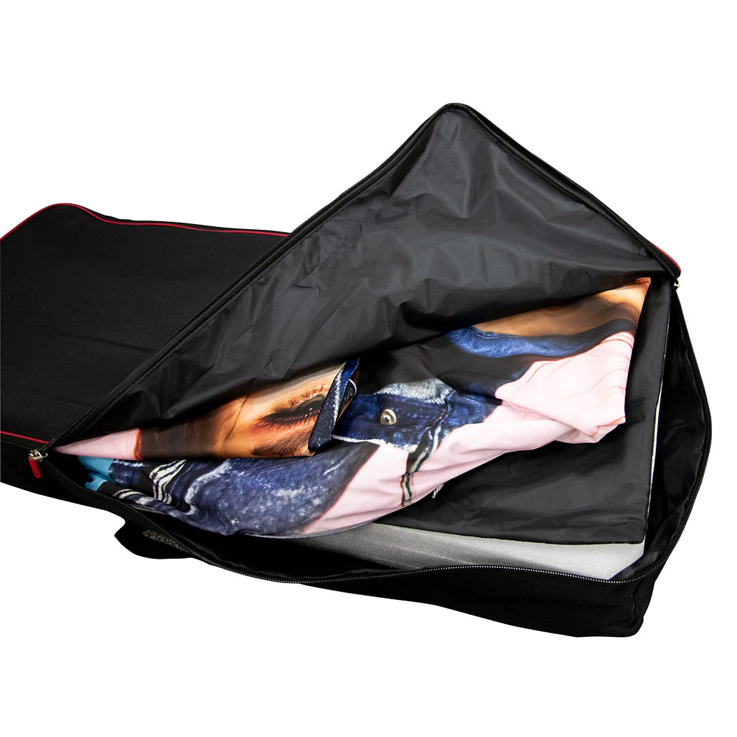 Wheeled carry bag unzipped with a folded fabric graphic packed inside