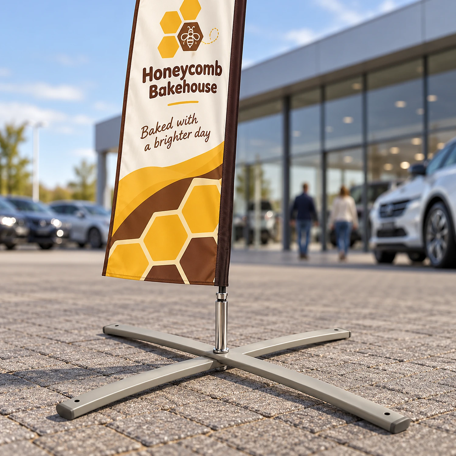 Large cross base holding a feather flag on a showroom forecourt