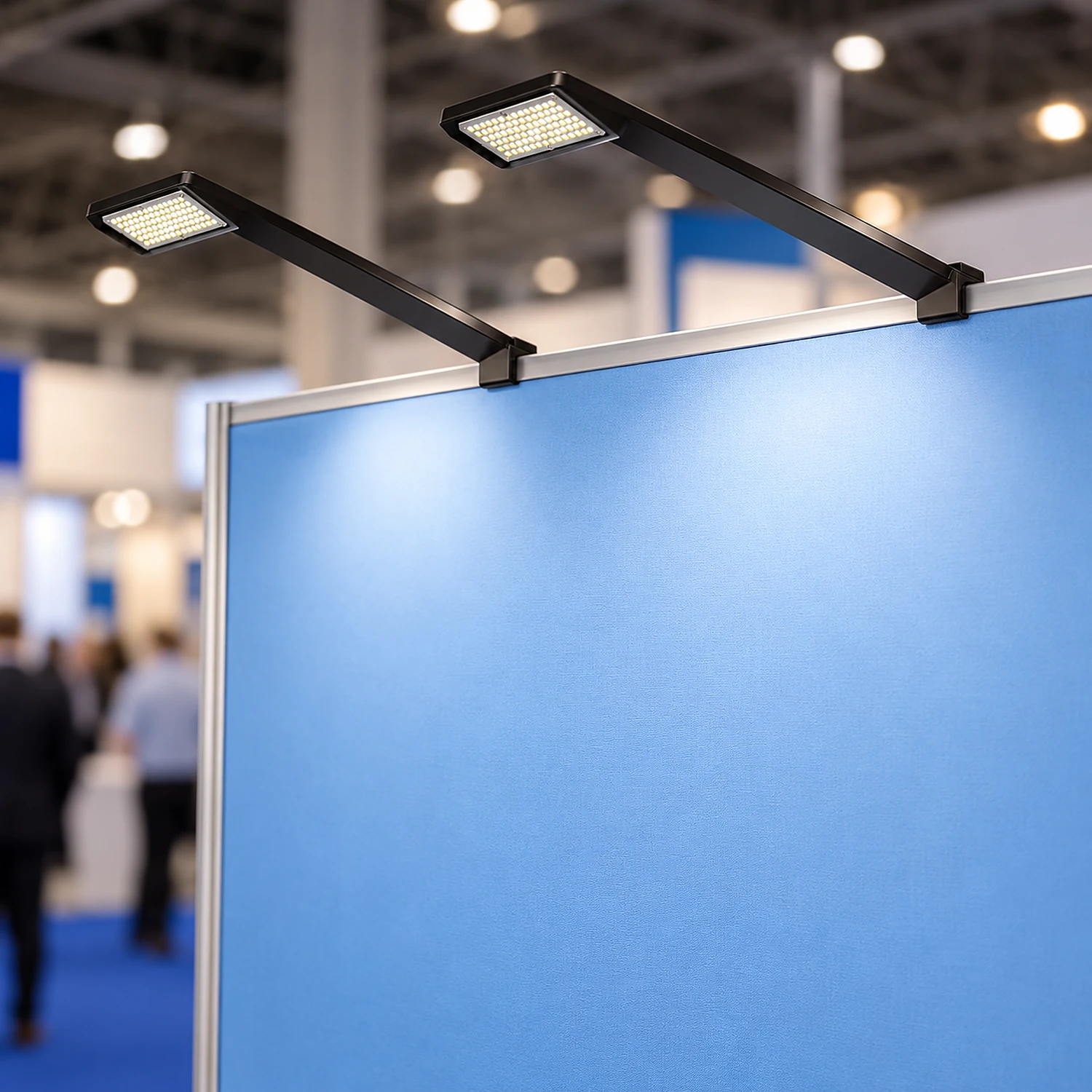 Two LED arm lights lighting a fabric backwall
