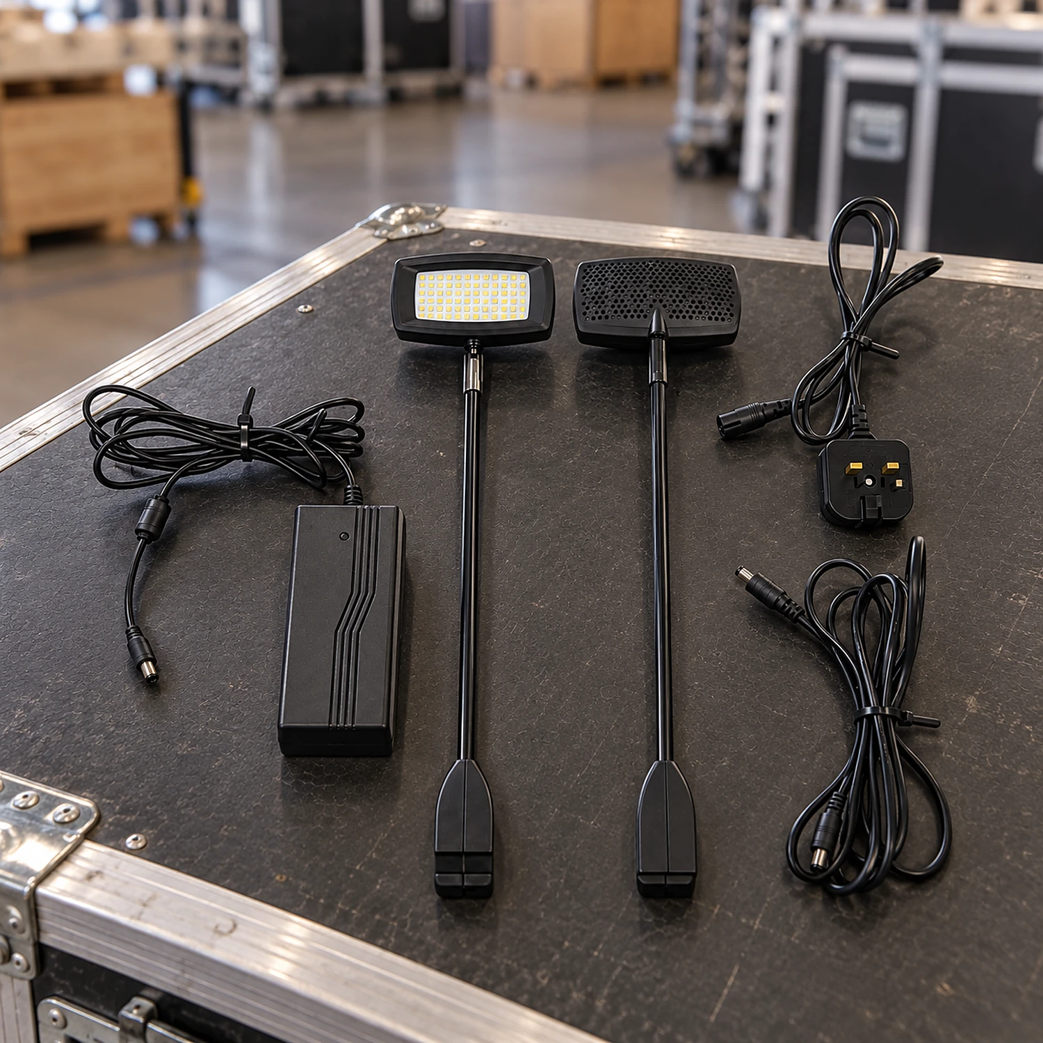 LED spotlight twin pack laid out on a flight case lid