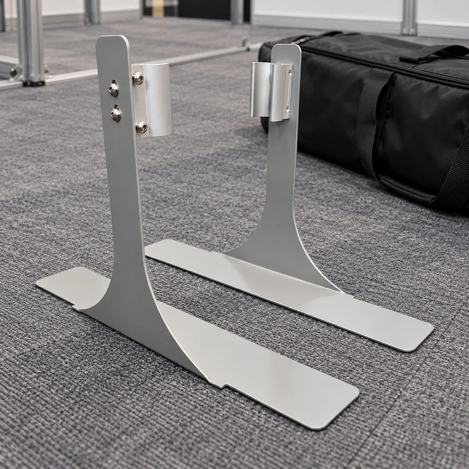 Pair of side feet on exhibition hall carpet