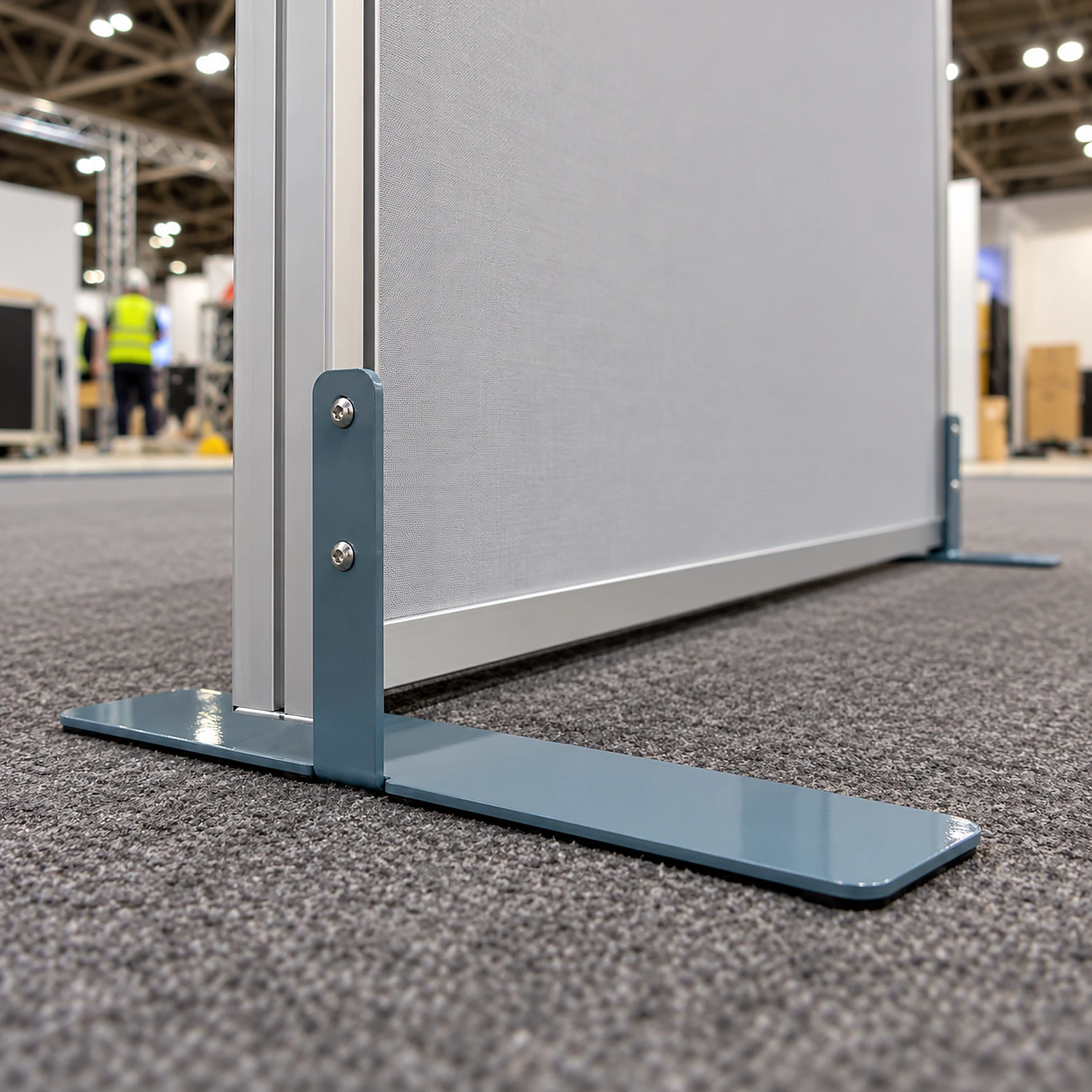 Side flat feet bolted to both ends of a freestanding frame wall