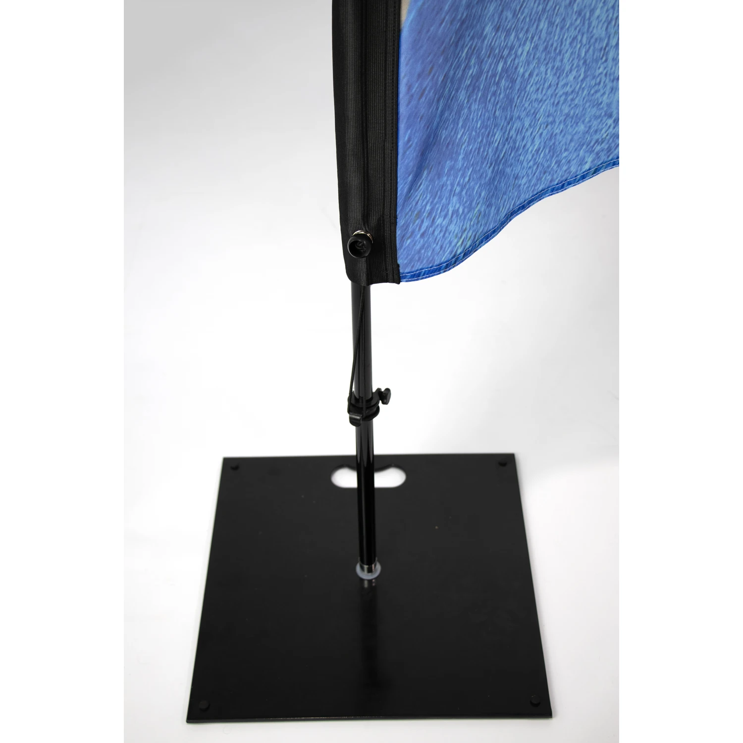 Square steel flag base with handle cut-out under a crest flag
