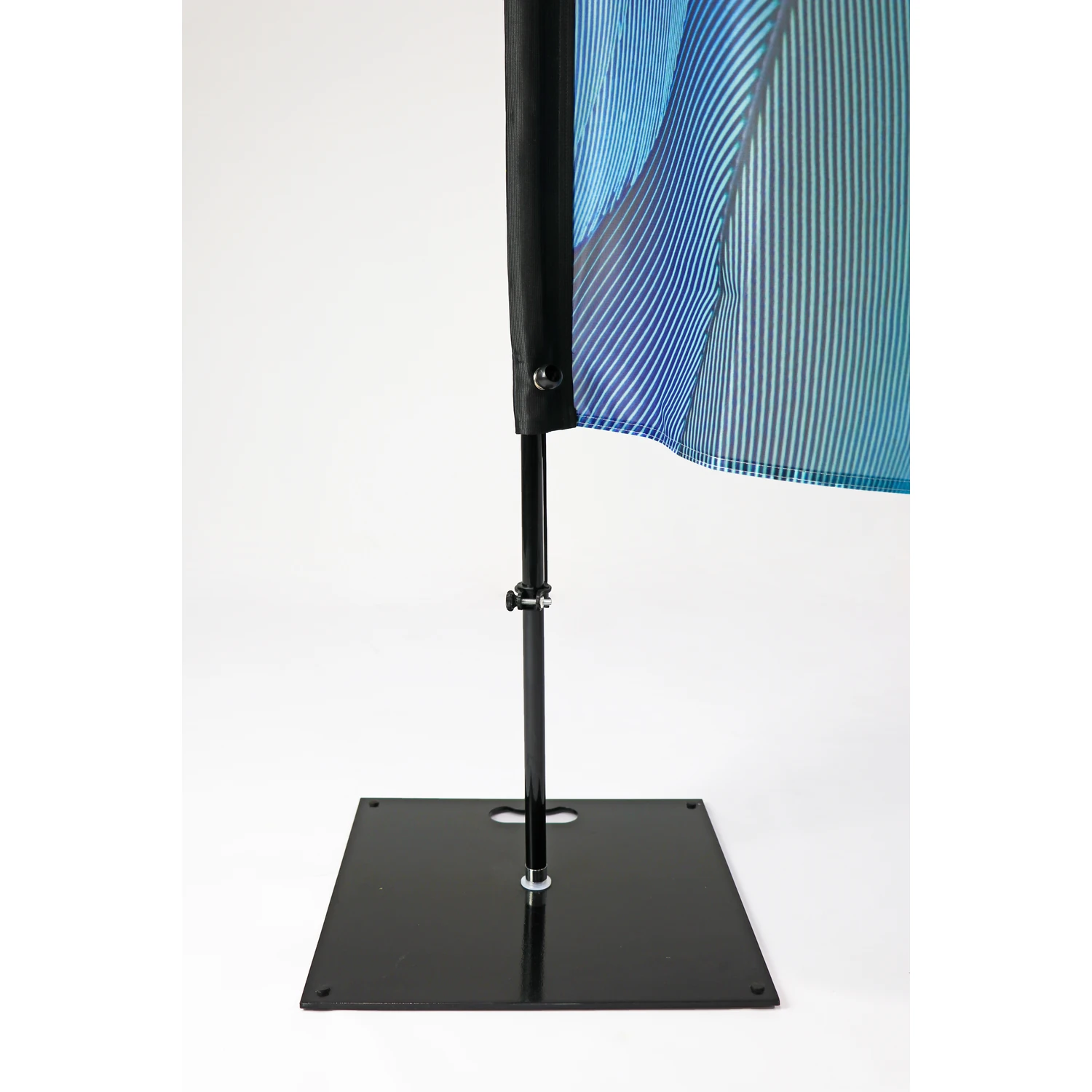 Square steel flag base holding a feather flag pole