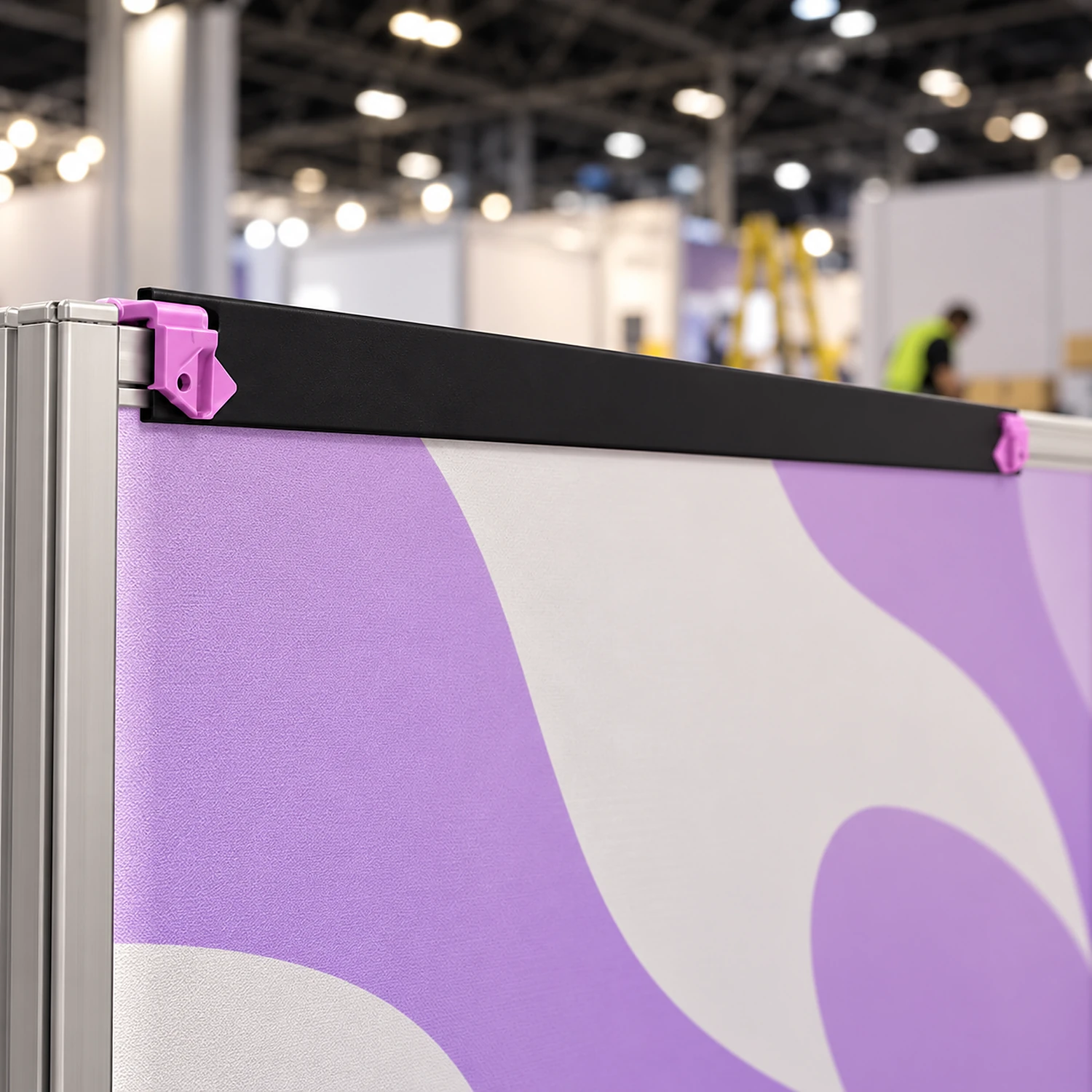 Hanger along the top of a straight pop up stand panel