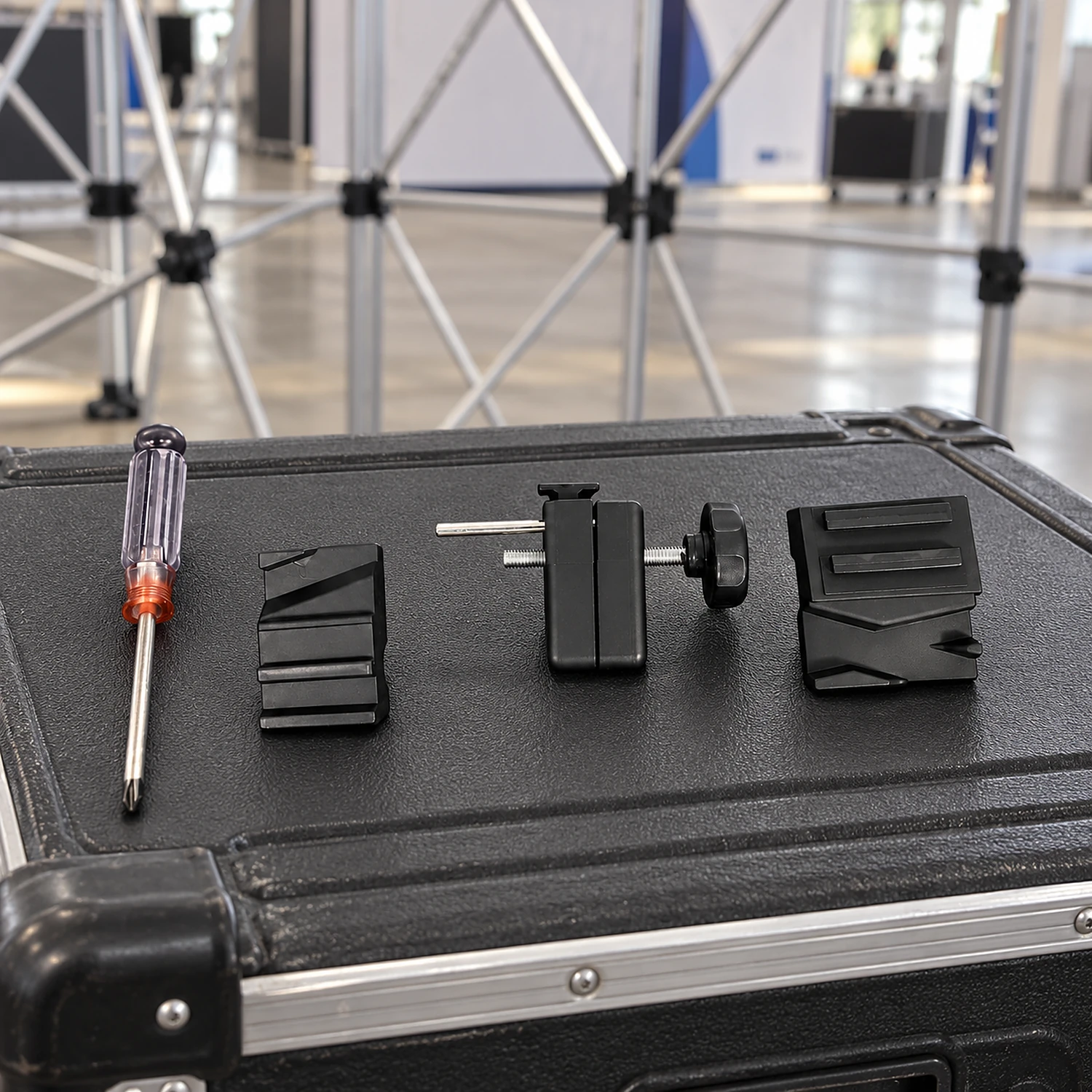 Light fitting kit parts on a pop up stand transport case