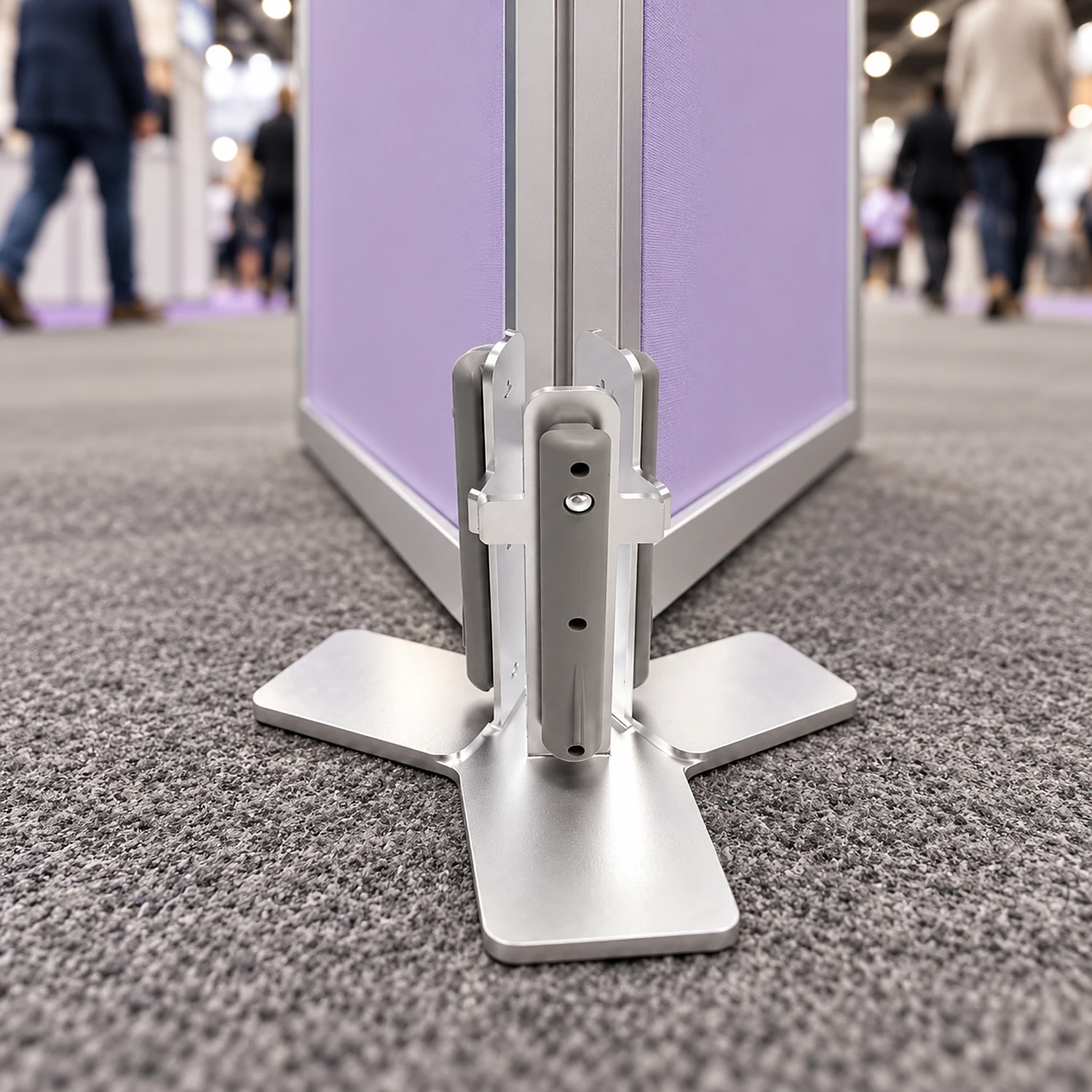 Y-shape connector at the foot of a fabric frame on a show floor