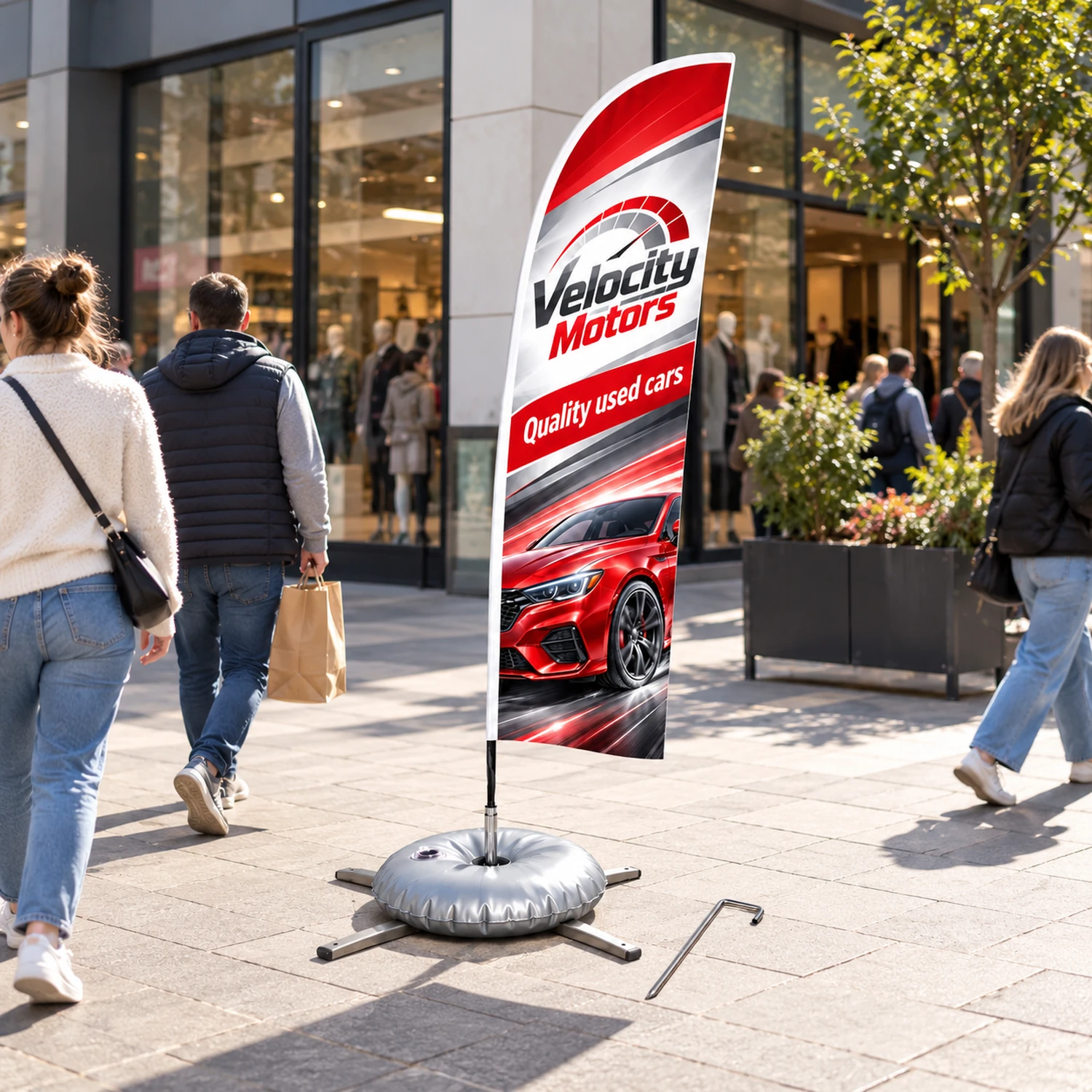 Zoom+ Feather Flag Set with Cross Base and Weight Ring in use at an event