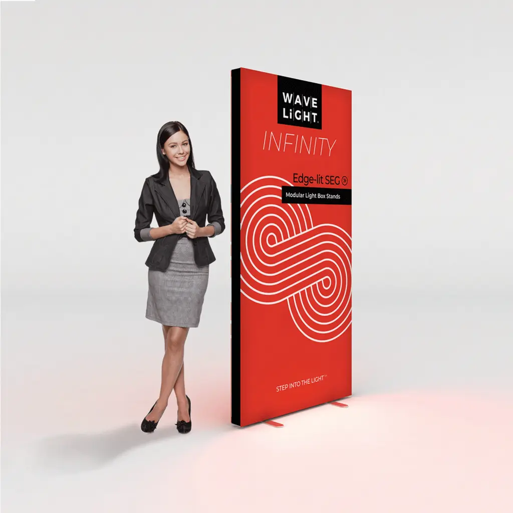 Modular edge-lit fabric lightbox standing beside a person for scale